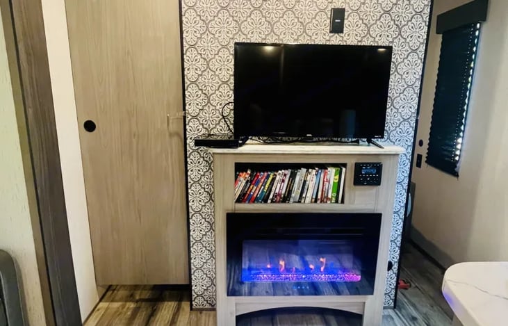 Fireplace in livingroom/kitchen. Stocked with tv and DVD player, plus a wide selection of DVDS.