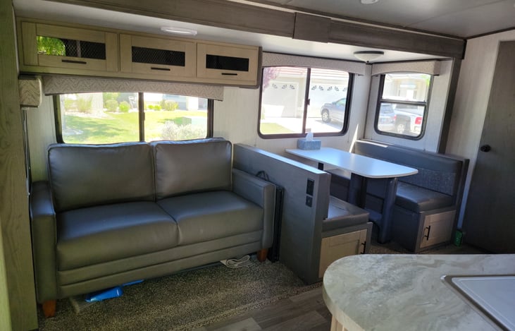 Couch pulls out to bed, and dinette transforms to bed as well.