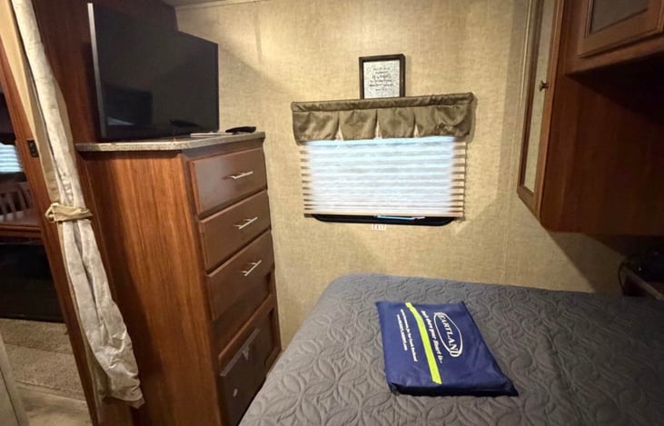 Queen size bed. Separate door leads outside from bedroom.
