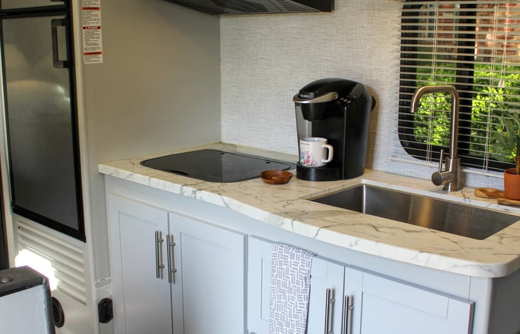 Plenty of storage for your favorite pots and pans! We provide utensils, plates, bowls and tumblers for a set of 4.