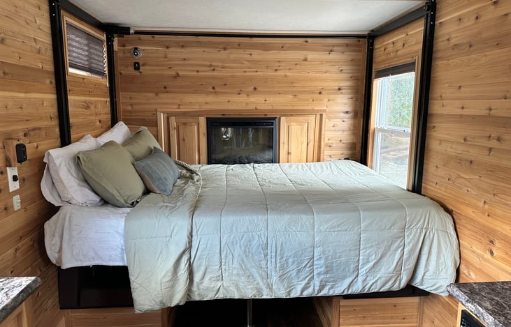 Drop down Queen bed with fire place.