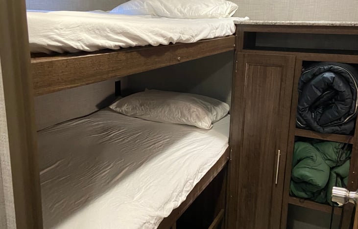 Bunk room. 2 adult sleeping bags & 2 child sleeping bags & 2 pillows