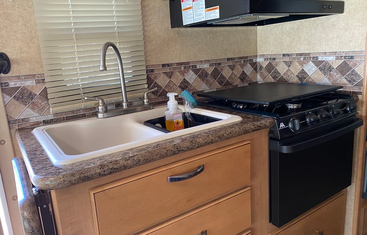 Sink, stove, and microwave.