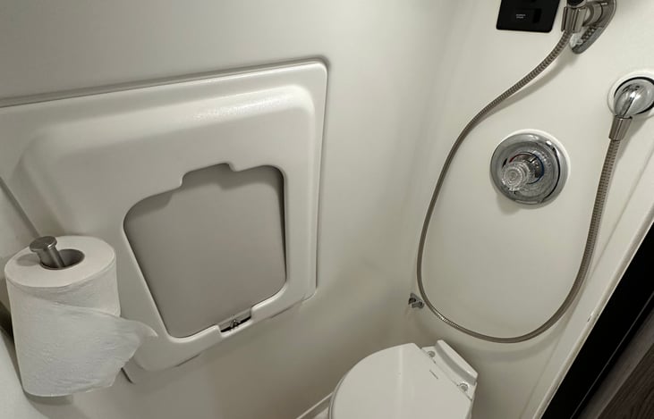 Wet bath and window with water repelling shade