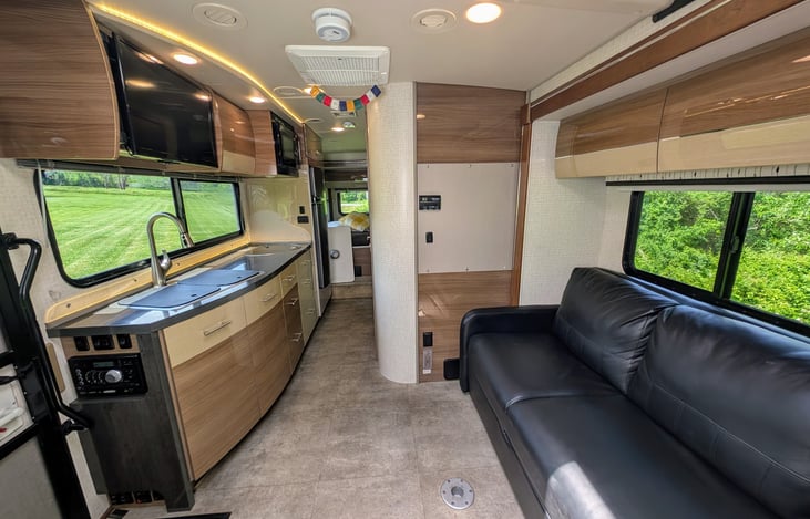 Classy and well-appointed interior with ample storage and premium materials throughout. Swing around captain's chairs and 2 positions for the dining table create a comfortable and flexible environment