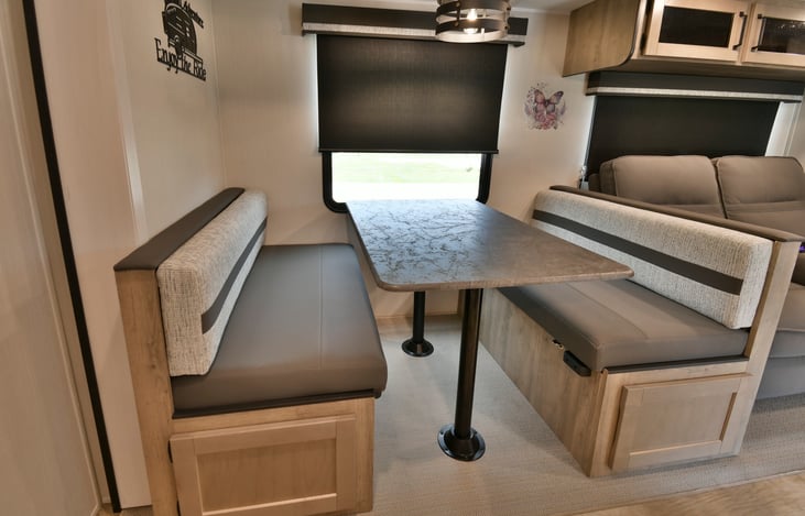 Dinette folds down for another sleeping area.