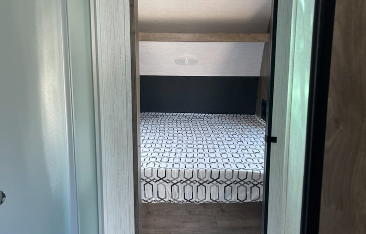 Queen master bedroom - not shown is a storage closet on each side of the bed.  All linens included!