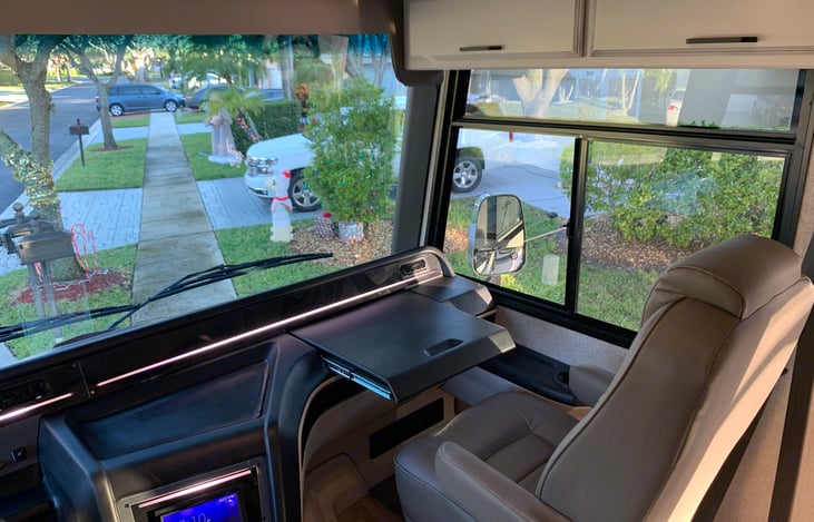 Passenger seat equipped with pull out desk for laptop or snacks!