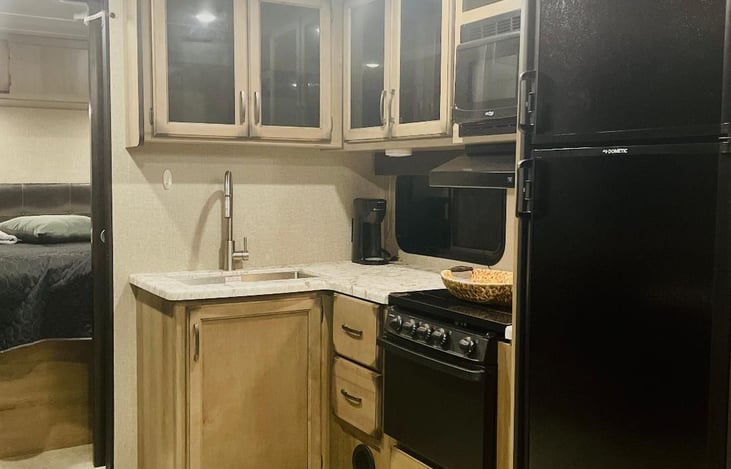 a small coffee - pod machine also available for your use! Kitchen has loads of storage, oven, microwave and refrigerator.