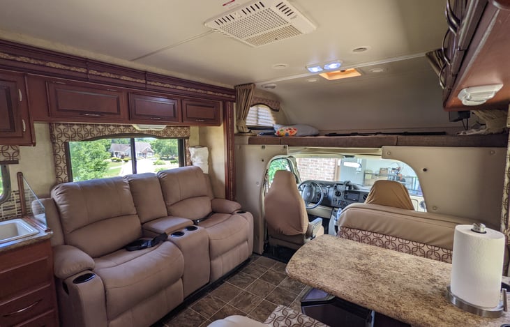 table drops to sleep 2 and bunk over driver area sleeps 2 adults or 3 short kids