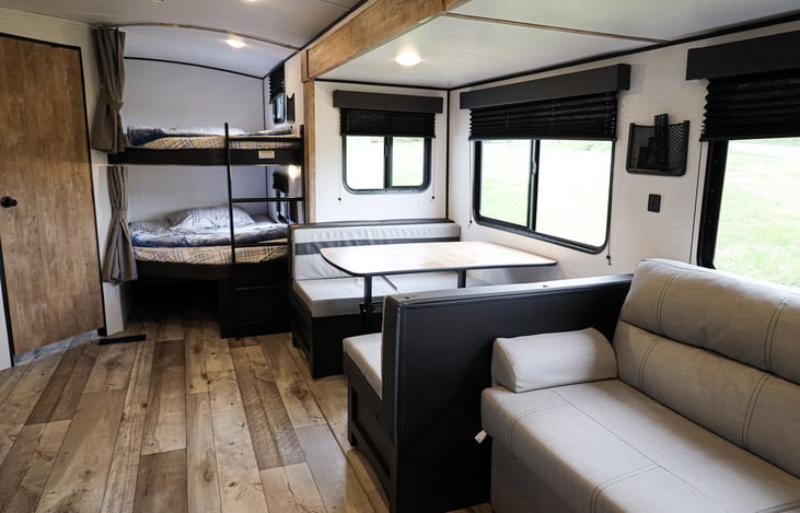 Both the couch and the dinette can be converted into beds.