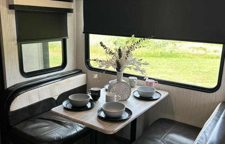 Dining Area with a big picture window to enjoy your morning coffee and see your beautiful view