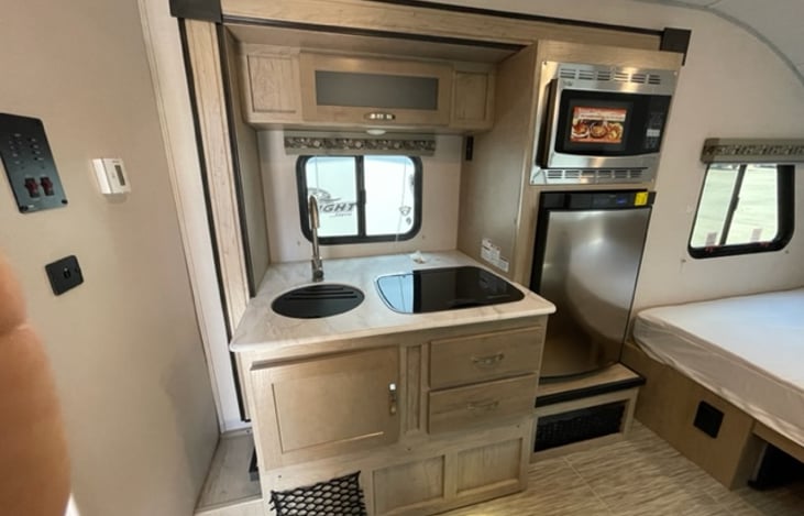 Prepare gourmet meals in this well-appointed kitchen with its convenient 2-burner stove top. Enjoy even heat distribution and intuitive controls, making meal preparation a breeze.