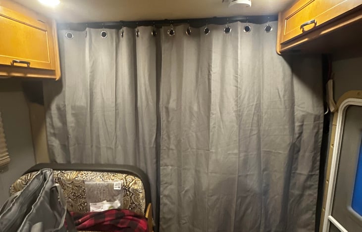 curtains that will close off the cab area when driving at night. Provides privacy for the bunk area too. Can also close off the windows without putting the outside cover on.