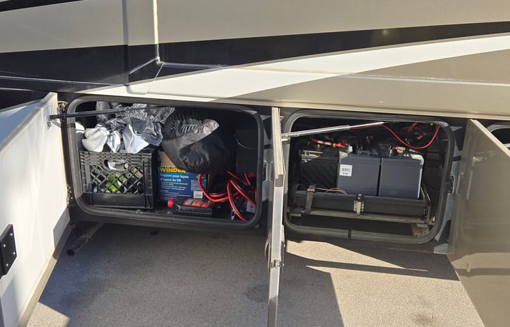 New indoor batteries truck batteries less than 2 years old compartment to the left will be all of your things for sewage shocking the motorhome and such.