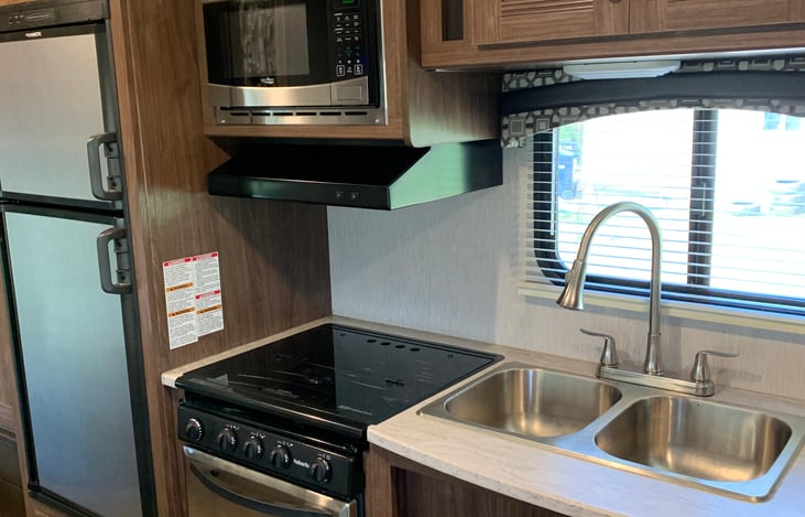 Kitchen area with stainless steel appliances