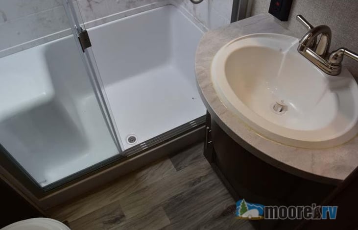 Bath with seat in the shower.