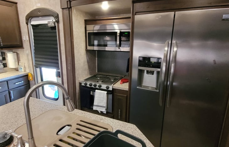 full sized fridge. water line has purposely been disconnected to prevent water damage.