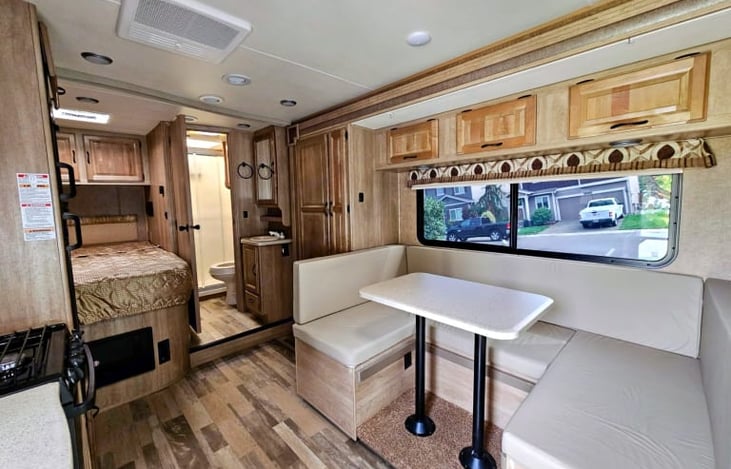 Din-net that turns into a bed, storage space under the cushions and have 5 lap seat belts