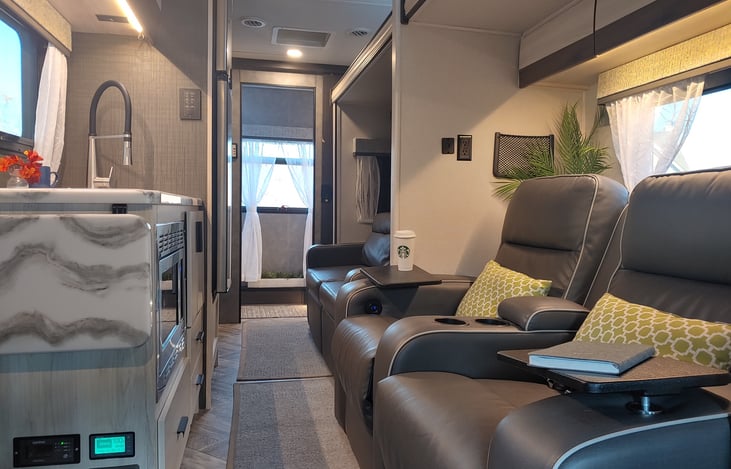 Slide closed. This is what it looks like while driving. Full acess to microwave, frig and bathroom.