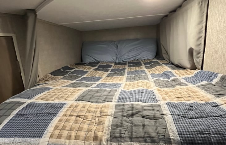 Top bunk. Features of this “room”
Include window for ventilation, light, USB charging port and curtain for privacy.