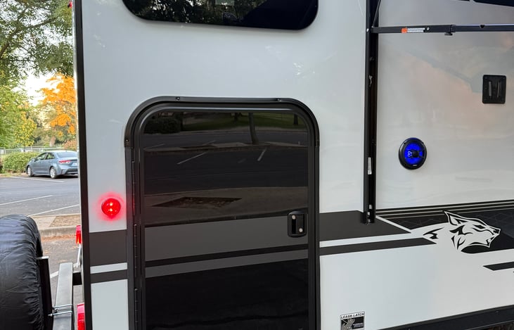 Exterior door for storage and access to bunks.