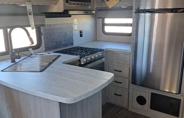 Fridge, gas stove, microwave and Kitchen sink.
Pots, panda & cooking utensils.