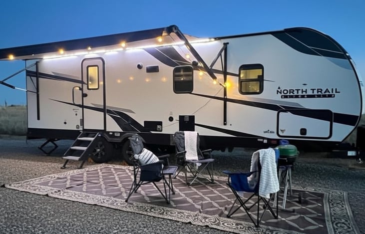 Spacious setup with seating, grill, and ambient lighting.