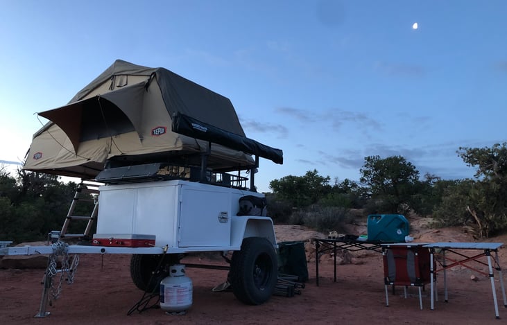 Cooking dinner under a moonlit sky