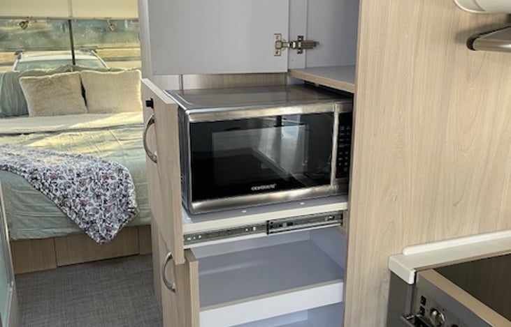 Tucked away microwave and storage drawers. Plenty of room for food.