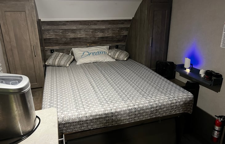 Queen-size murphy bed front living area.