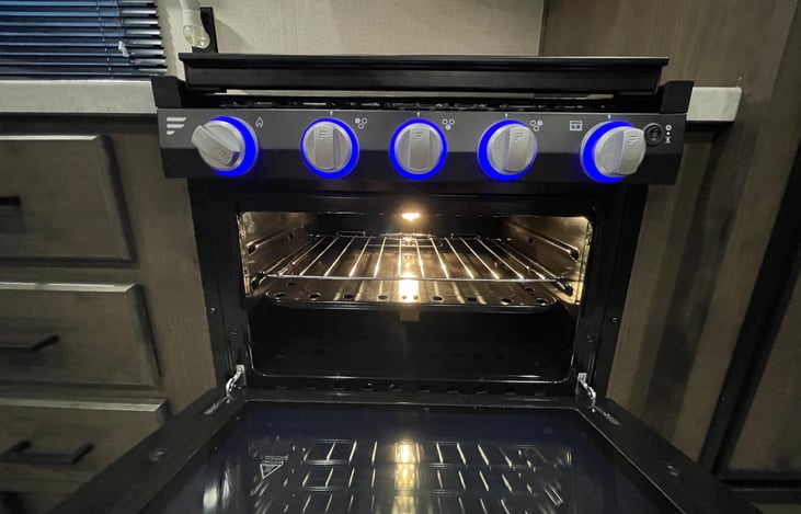 Illuminate your culinary journey with our oven’s blue-accented knobs—adding both practicality and ambiance to your Pure Michigan evenings.