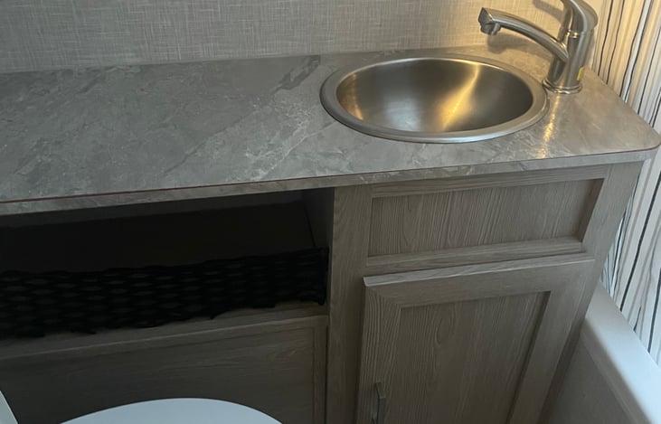 Bathroom stainless steel sink and countertop with storage cabinets