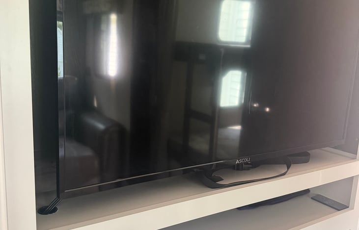 50" Flat screen TV. CD player and music station.