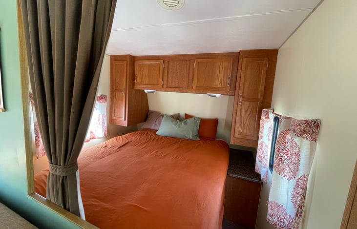 Queen bed in front area. The curtain acts as a divider for some visual privacy.
All of our bedding is organic cotton or at least OEKO tex certified.
We use European style duvets & covers.