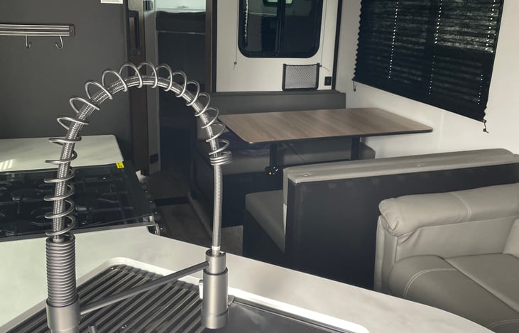 With the slide in. Still room to walk and use restroom if needed while on the road.