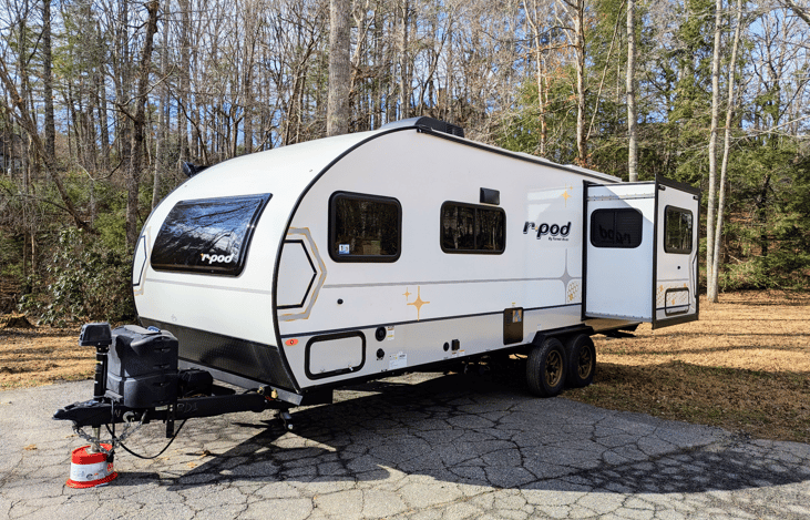 Experience luxury in this 2024 R-Pod 204! Loaded with modern amenities and technology, this whimsical camper features a walk-through bath, a queen-bed slide, on-demand water heater, solar power, inver