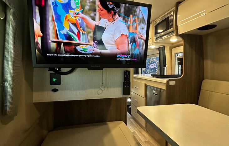 Wall mounted TV, perfect for entertaining the kids or a movie in bed.