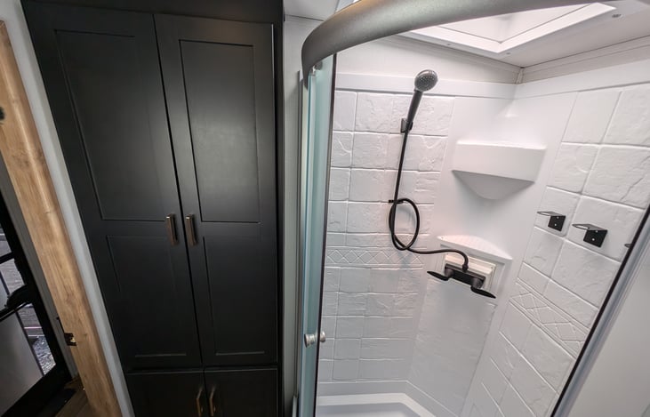 Very spacious bathroom with storage.