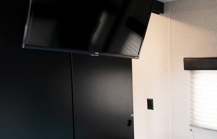 Master bedroom with queen-size bed, comfy 3" foam mattress topper, linens, storage and TV with streaming services