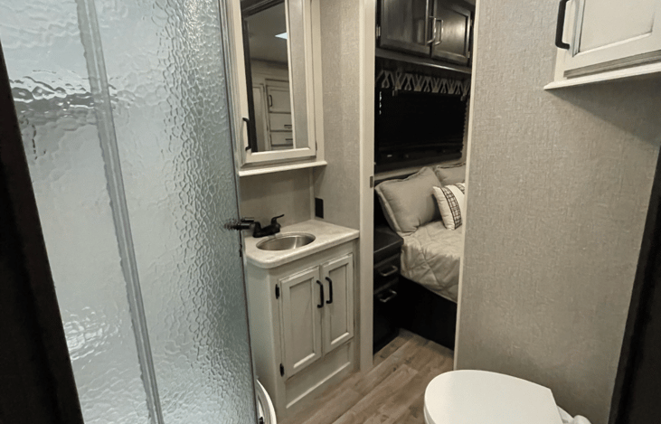 Bathroom! Stand Up Shower w/ Glass Doors! Toilet with RV Bidet! Access from main cabin or private access from master bedroom!