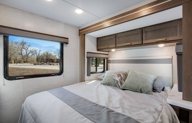 Queen walkaround bedroom has lots of windows (this is the slide)