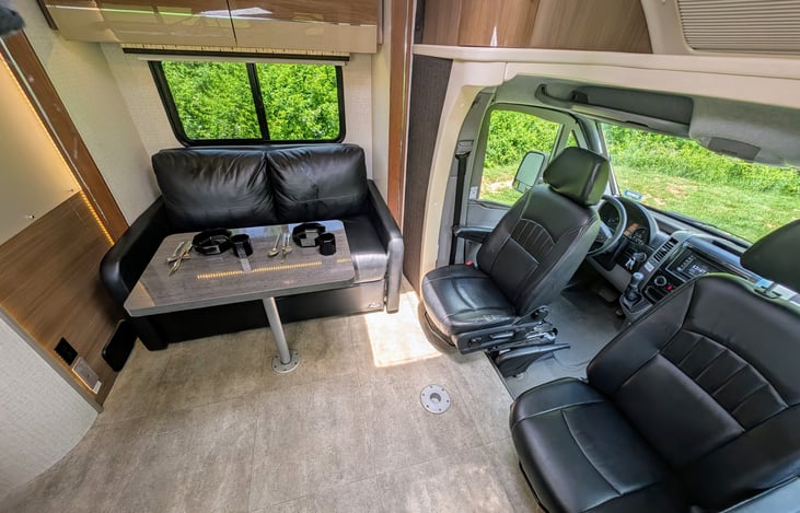 Classy and well-appointed interior with ample storage and premium materials throughout. Swing around captain's chairs and 2 positions for the dining table create a comfortable and flexible environment