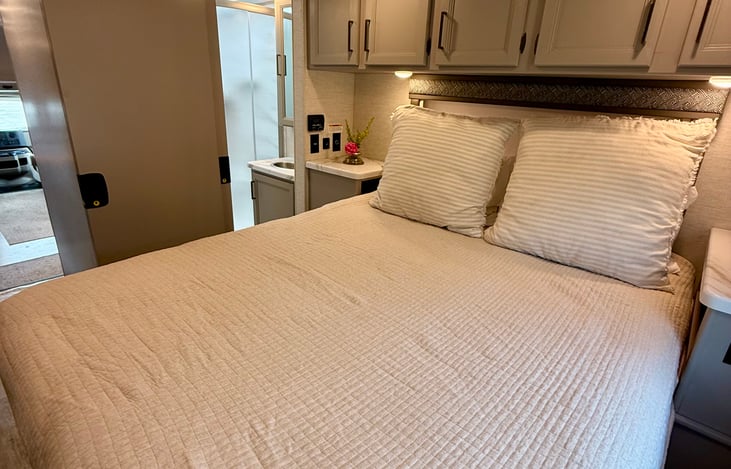 Main bed, second entrance to bathroom