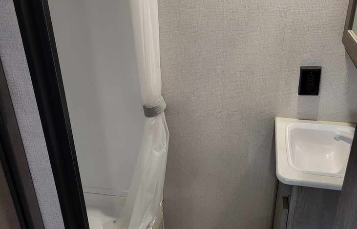 Bathroom includes, toilet, sink, and shower.