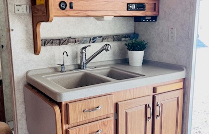 Dual sinks bluetooth audio player with indoor outdoor speakers.