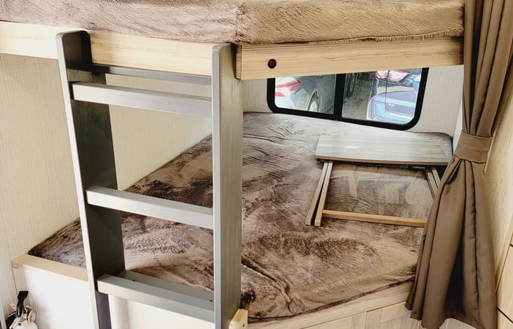 Bunk beds for 2 people each bed. Window and light in each space.