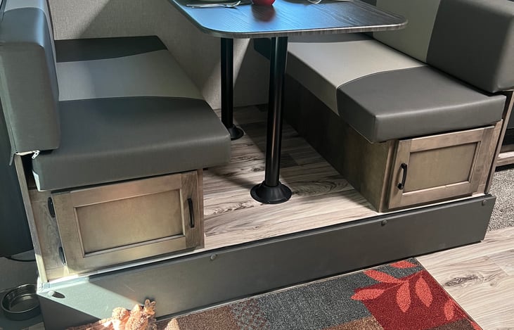 Storage under dinette benches.