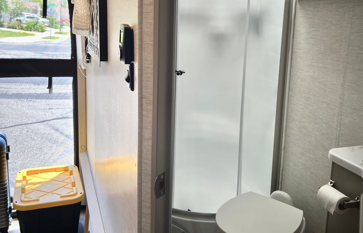 Rear of the RV. Bed on left folds up for storage. Bathroom on the right.