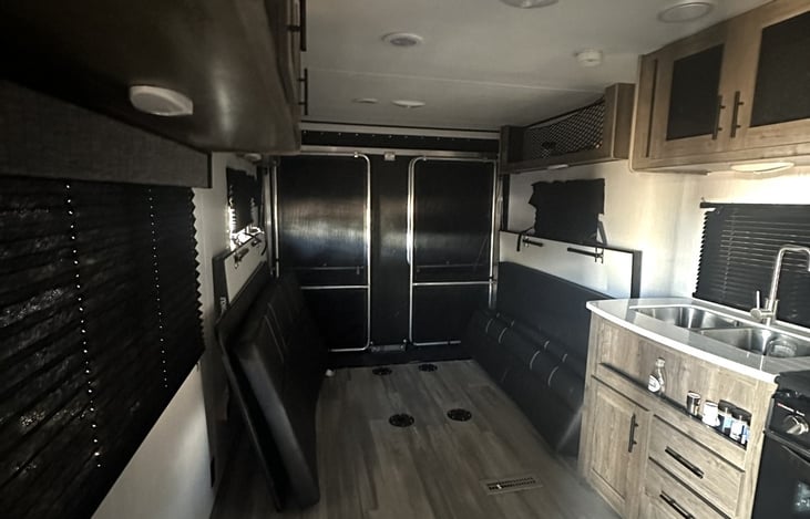 Kitchen, garage shown with benches folded up and table down for loading
